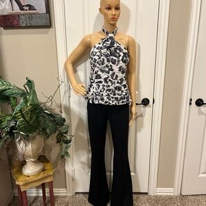 “ROMEO AND JULIET COURTURE” BLACK HIGH RISE BLACK FLARE PANTS WITH PLEATED FRONT